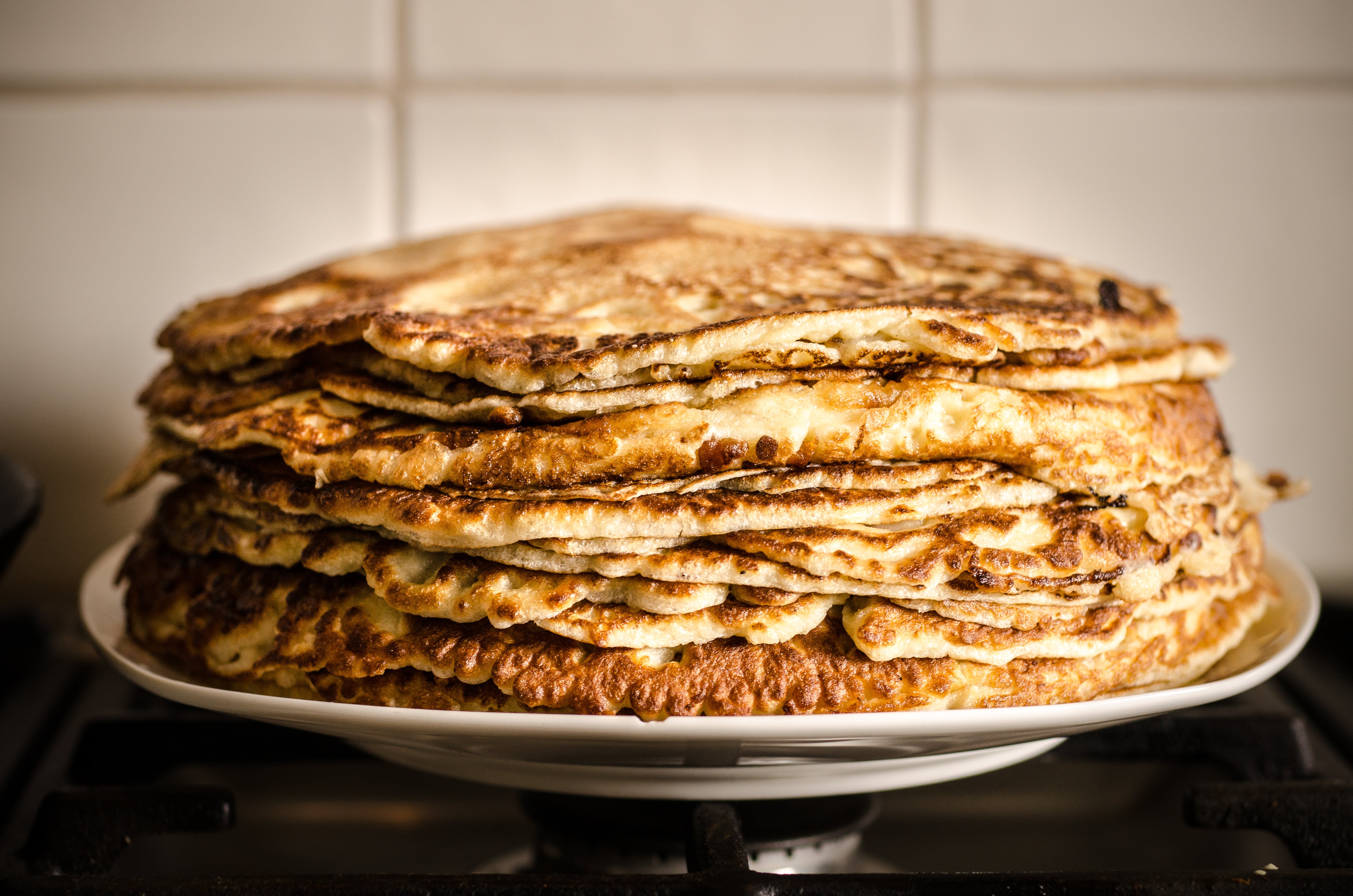Picture of pancakes stacked inside a plate.